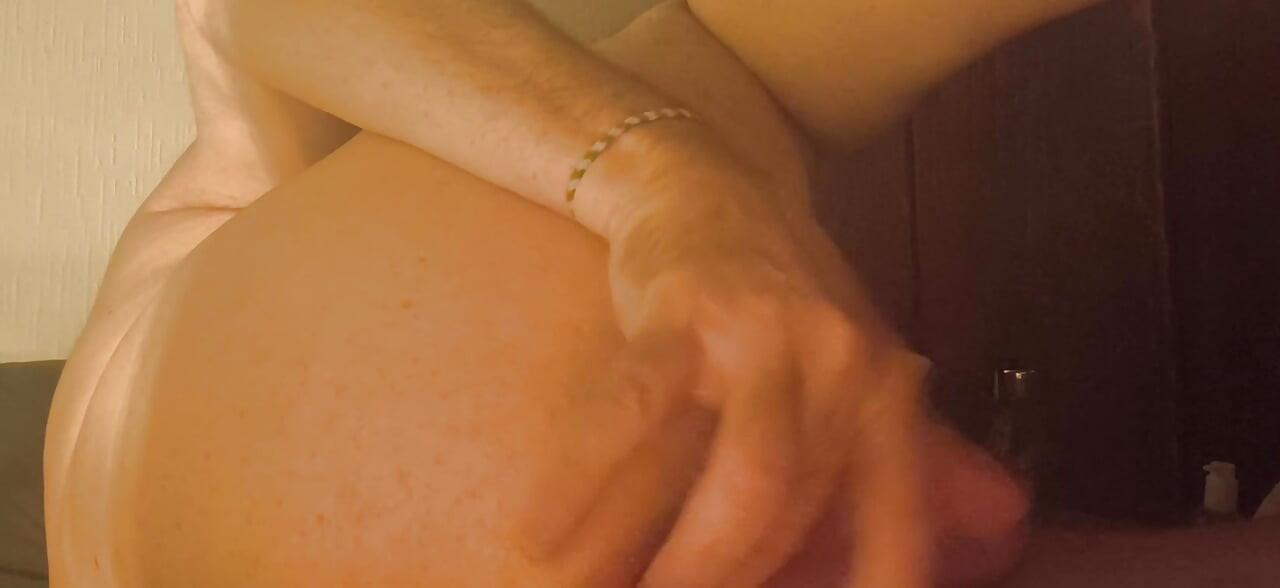 Grandpa stimulates his anus with his fingers and his special prostate dildo and it makes him wet