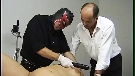 Mature blonde gets fisted and whipped by dominating males
