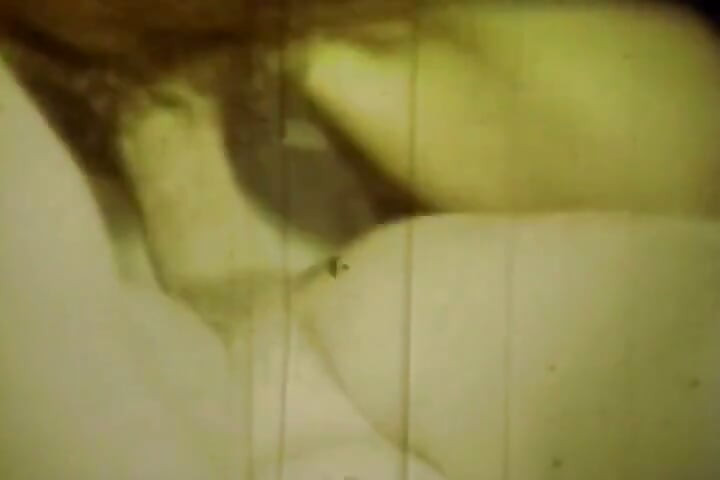 Worn Sepia Loop Captures Curly Retro Couple in Raw Bedroom Passion