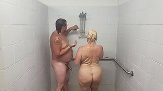 Husband and wife taking a shower with a quickie.