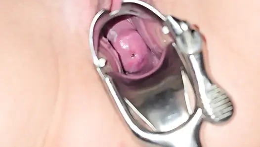 Milf inspects her pussy and inserts speculum to see inside