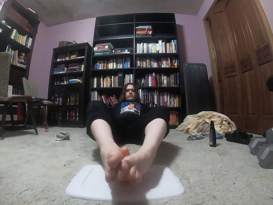 Chubby boy gives his dildo a footjob