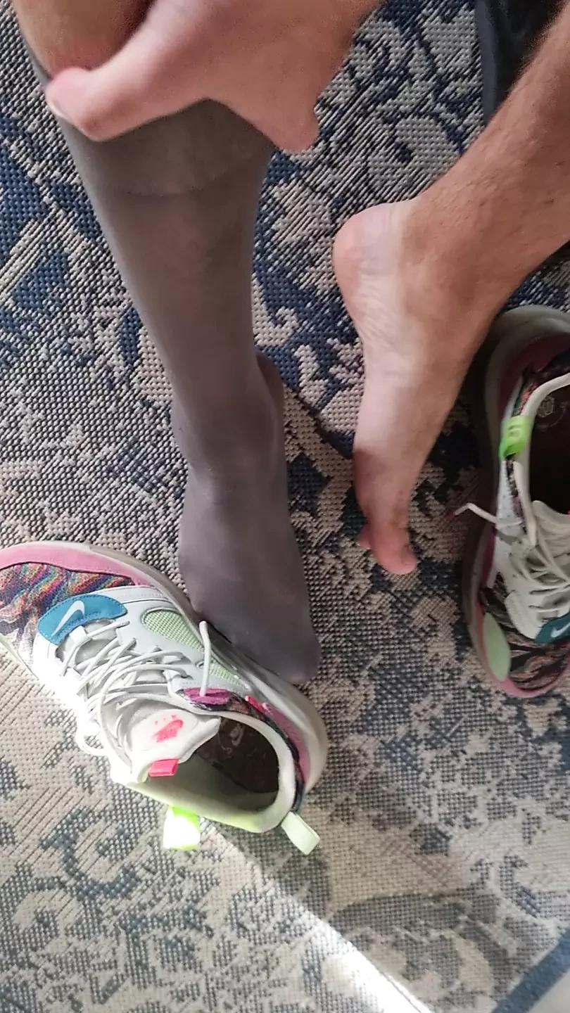 Sexy feet in sheer socks and sneakers fetish