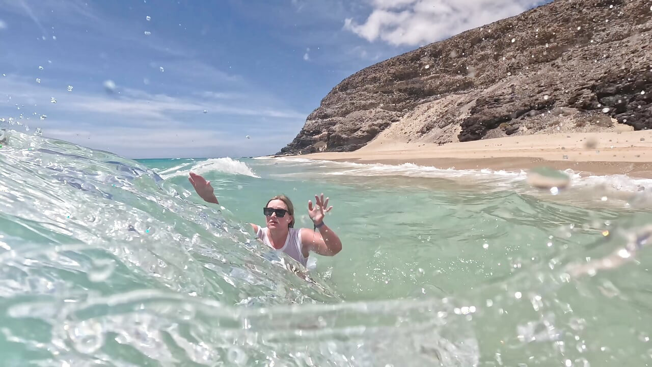 Girl Wetting Jeans in the Ocean and Swimming in Wet White T-shirt