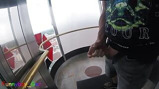 I jerk my cock very riskily in a public, transparent outdoor elevator on the 13th floor.