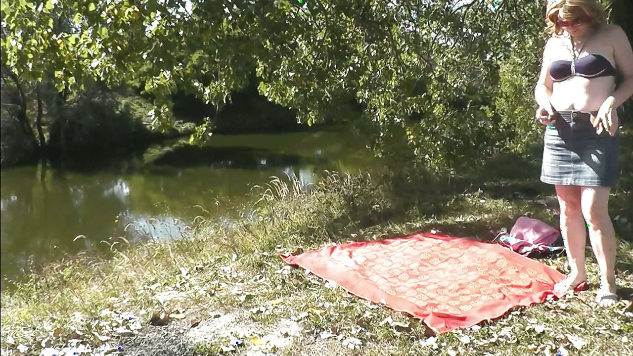 Sexy mature milf sunbathes naked on shore river fingering masturbating hairy pussy and orgasm. Outdoor Outside Naked public Solo