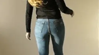 Slim girl walking in skintight blue jeans and highheels 2