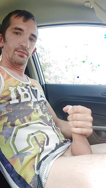 A young man cums his big in his car