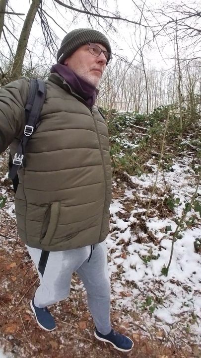 Snowy forest walk with soaked pants