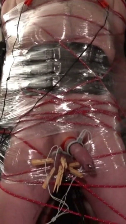 Frankenslave is suspended in cling film bondage with electro play in the dungeon of Lady Diva Cane | Clip 1