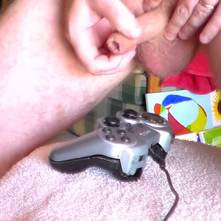 John is peeing all on a gamepad