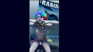 Boy with clown costume gets ready