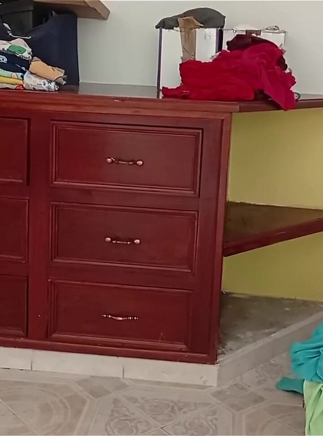 Chubby Girl Tidying the Room and Folding Clothes