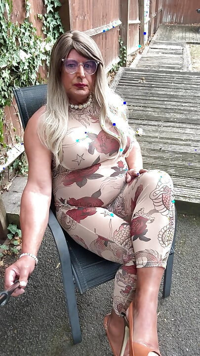 Sexy Crossdresser kellycd2022 in sexy floral see thru catsuit and heels