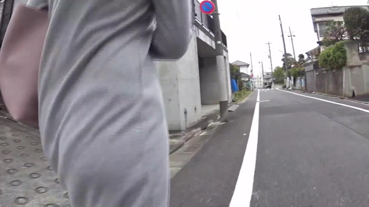 An Individual Follows A Scantily Clad Woman To A Secluded Area