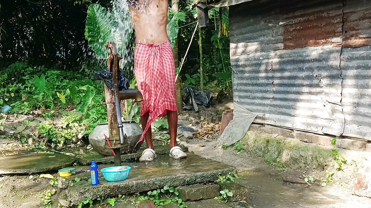 Desi young man bath Open place.