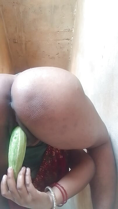 Sexy sister-in-law cooling the heat of her with cucumber