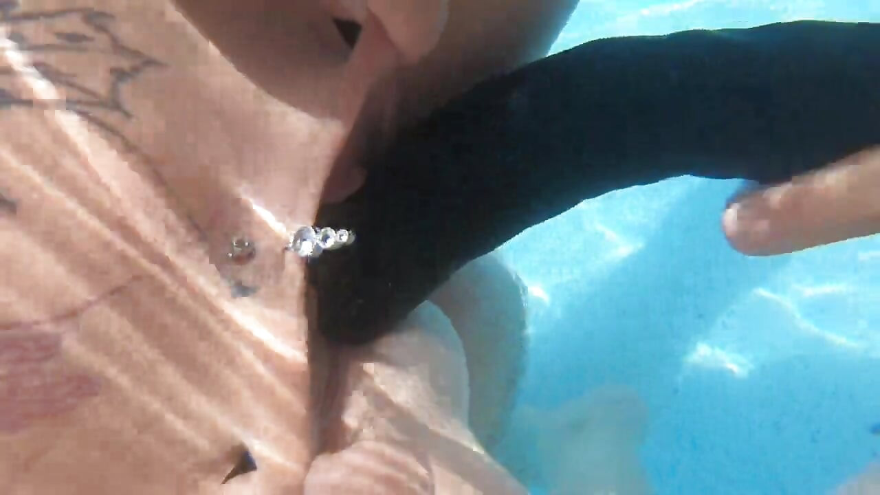 Camilla and Cheyenne Play with a double ended dildo in the pool