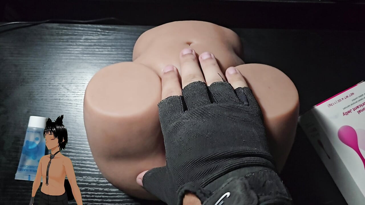 Playing with the pussy of a sex toy!