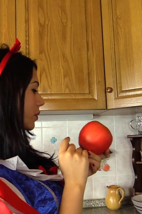 Hot brunette dressed as snow-white massages her feet