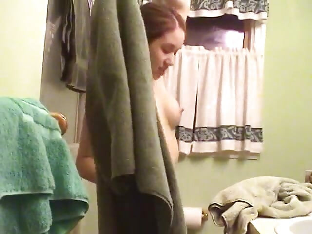 Cute brunette teen soaps up in the shower and takes time to trim her bush