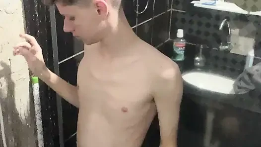 A Twink showing his body and naked at shower