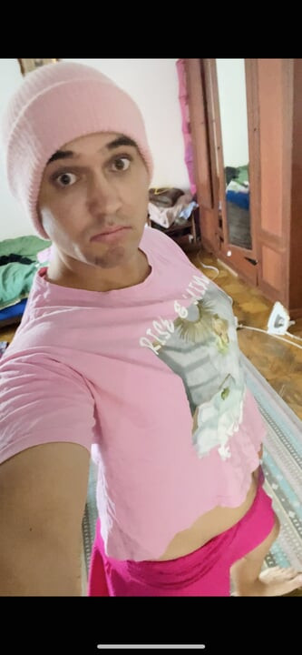 sissy in pink fucks her mouth with a dildo