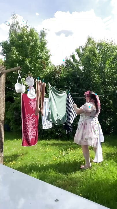 In outfit with a little babydoll dress to hang the laundry.