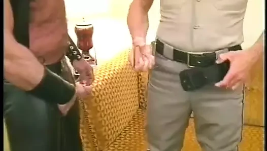 Muscular horny bear in leather chaps gets his cock slurped by police