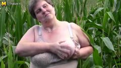 Old fat BBW mother fucks herself outdoor