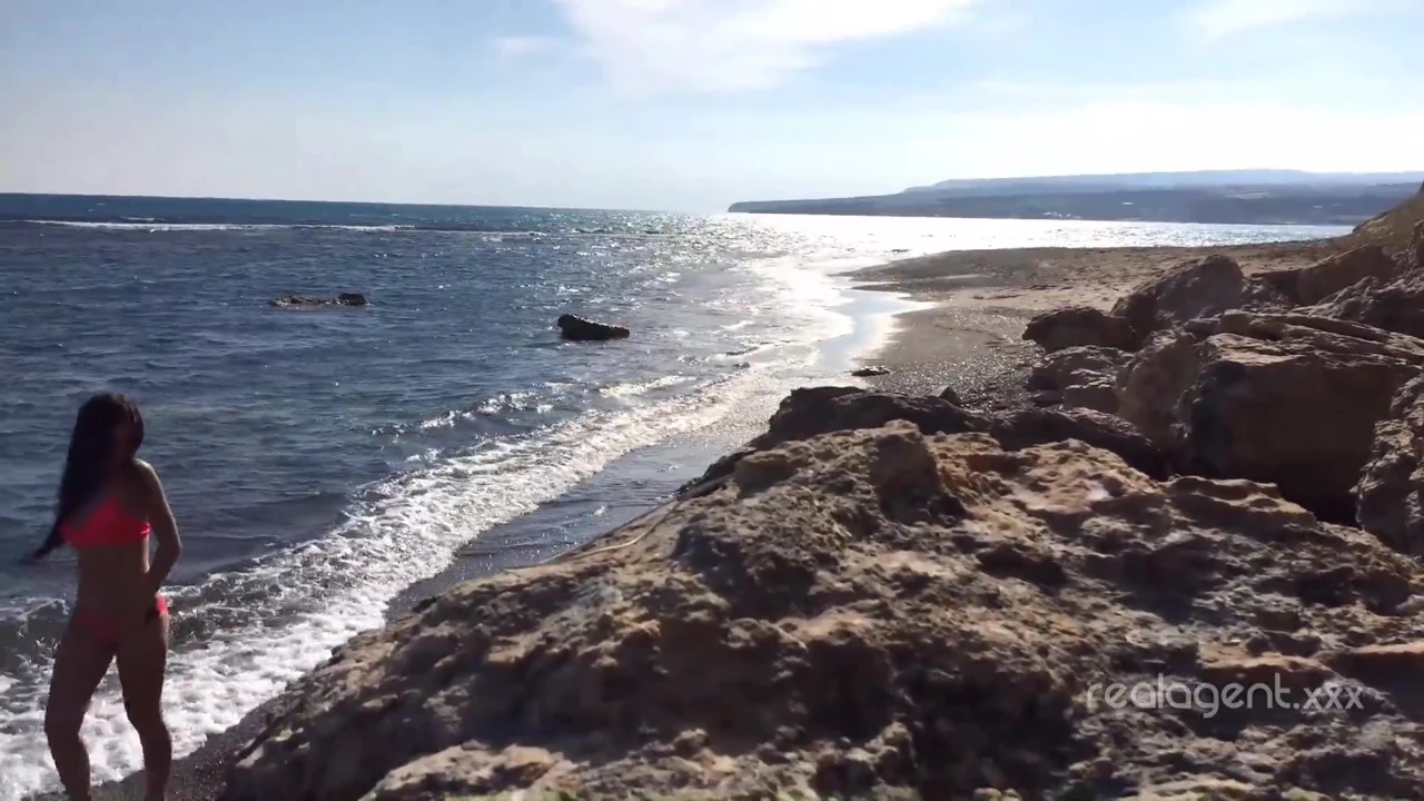 Alone lush Russian babe toys her cunt on the rock on the sea shore