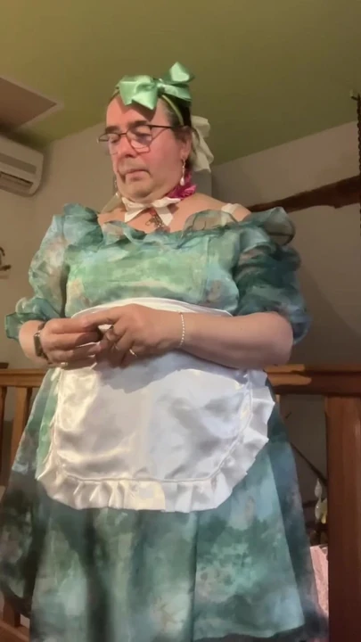 In a baby doll outfit with a diaper and pee in it
