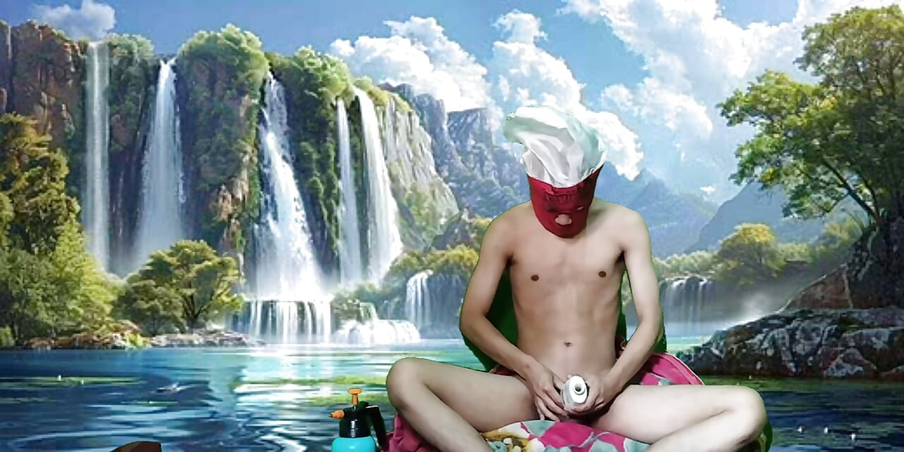 Masturbating with a dildo made from a bottle, used under a waterfall.