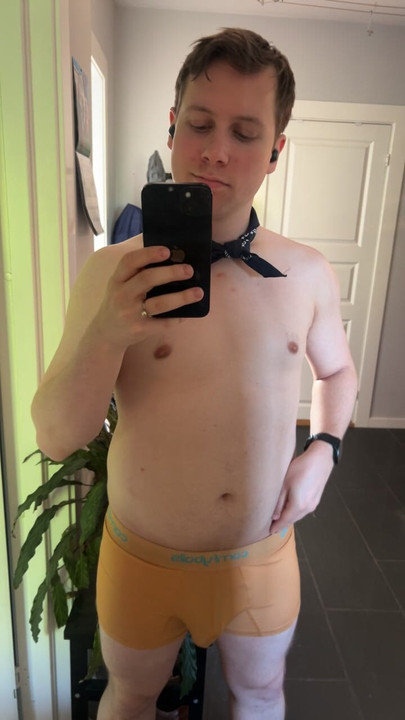 Locked sub showing off his caged cock in chastity