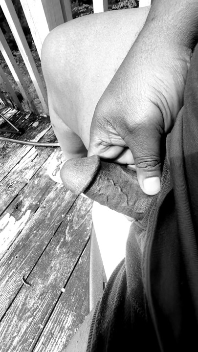 Jerking of on the deck in black and white.
