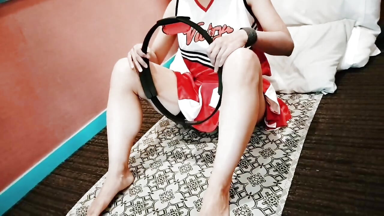 A cute, busty married woman does exercise 1 in an erotic cheerleader costume. Home made amateur Private Shoot