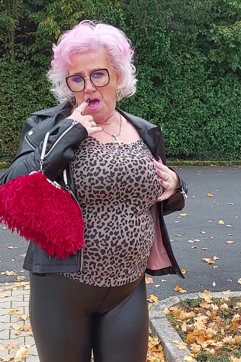 Naughty Granny Tongue Out Flashing Big Tits in Public