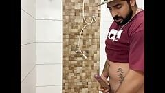Squirting cum, bearded in a cap alone in the bathroom having fun in the handjob until cumming a lot - Rodrik Dick