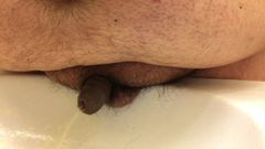 ultra close view of chub's tiny uncut willy peeing