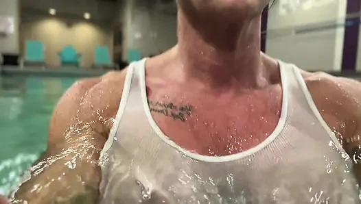 Amazon Kandy Flexes Her Massive Biceps in Her Hotel Pool