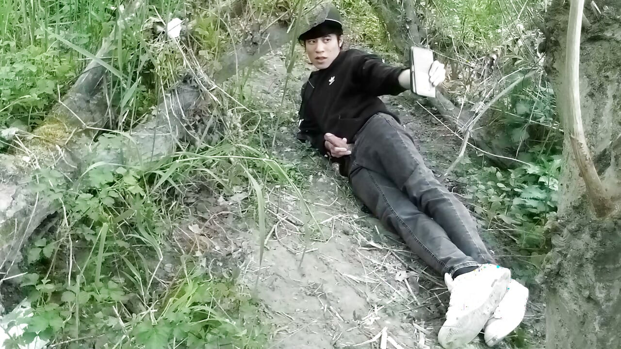 Cute Jon Arteen Gay twink jerks off outdoors, dry-humps the air, and shoots cum through a hole in his pants