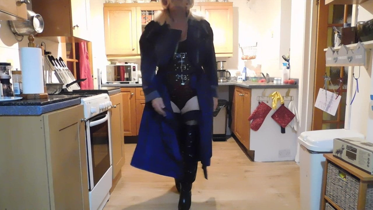 Sexy rubber mackintosh and thigh boots