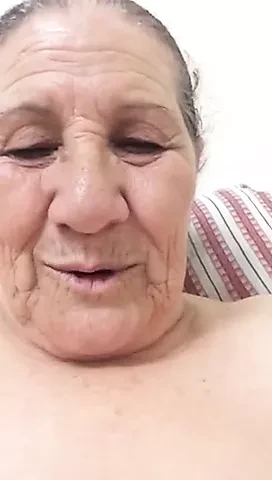 An old woman shows herself
