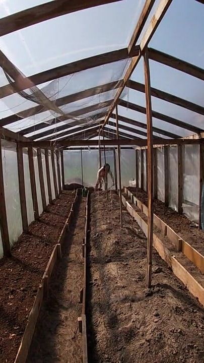 Nude house wife working in the greenhouse