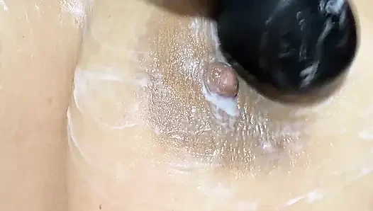 Mom vibrates her big tits with her big vibrator