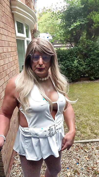 Sexy Crossdresser kellycd2022 in sexy white mini dress and fishnet pantyhose and heels