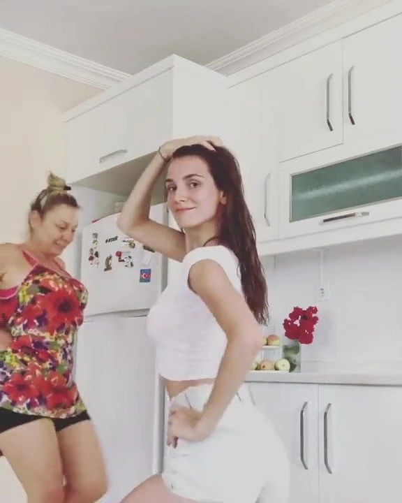 Non nude pretty girl dances in her kitchen