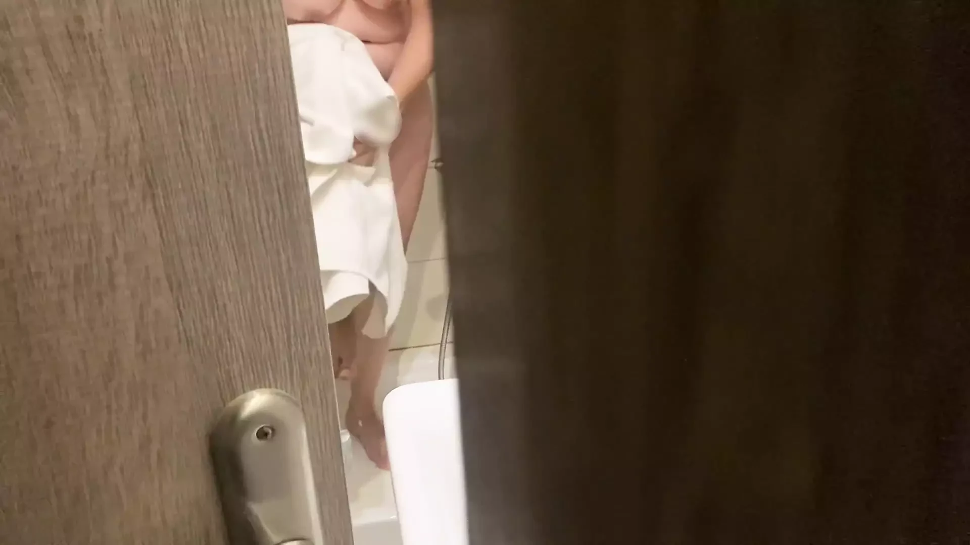 Stepbrother spied on his stepsister in the hotel bathroom and fucked her