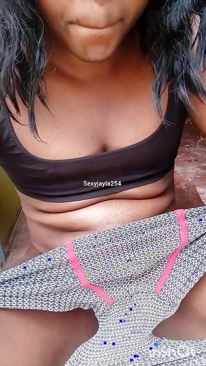 Horny African shemale stroking her dick outside until cum