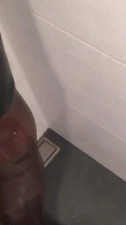 Iconic moment from "Fetish Crossdresser pissing on Latex Stockings"